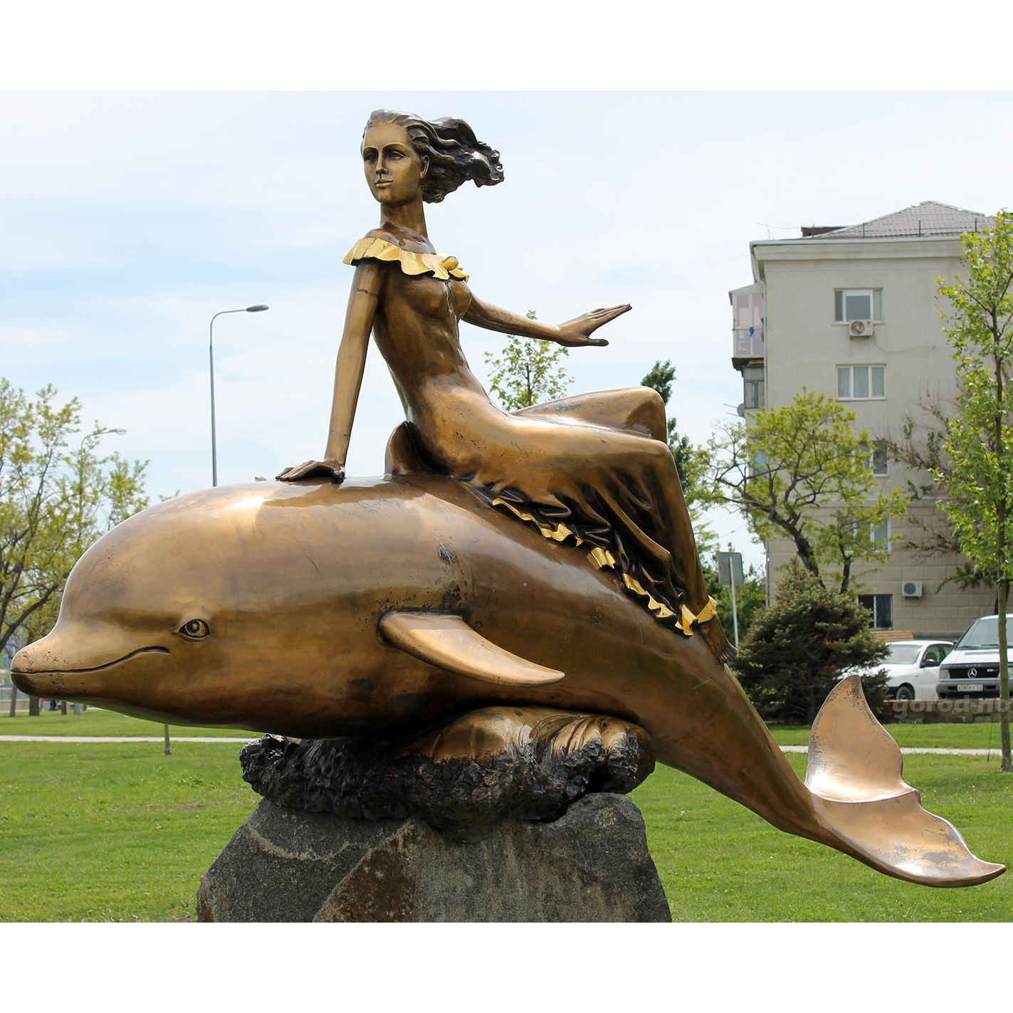 the bronze sculpture girl on a dolphin